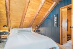 A queen bed and plenty of storage in this upper level guest room
